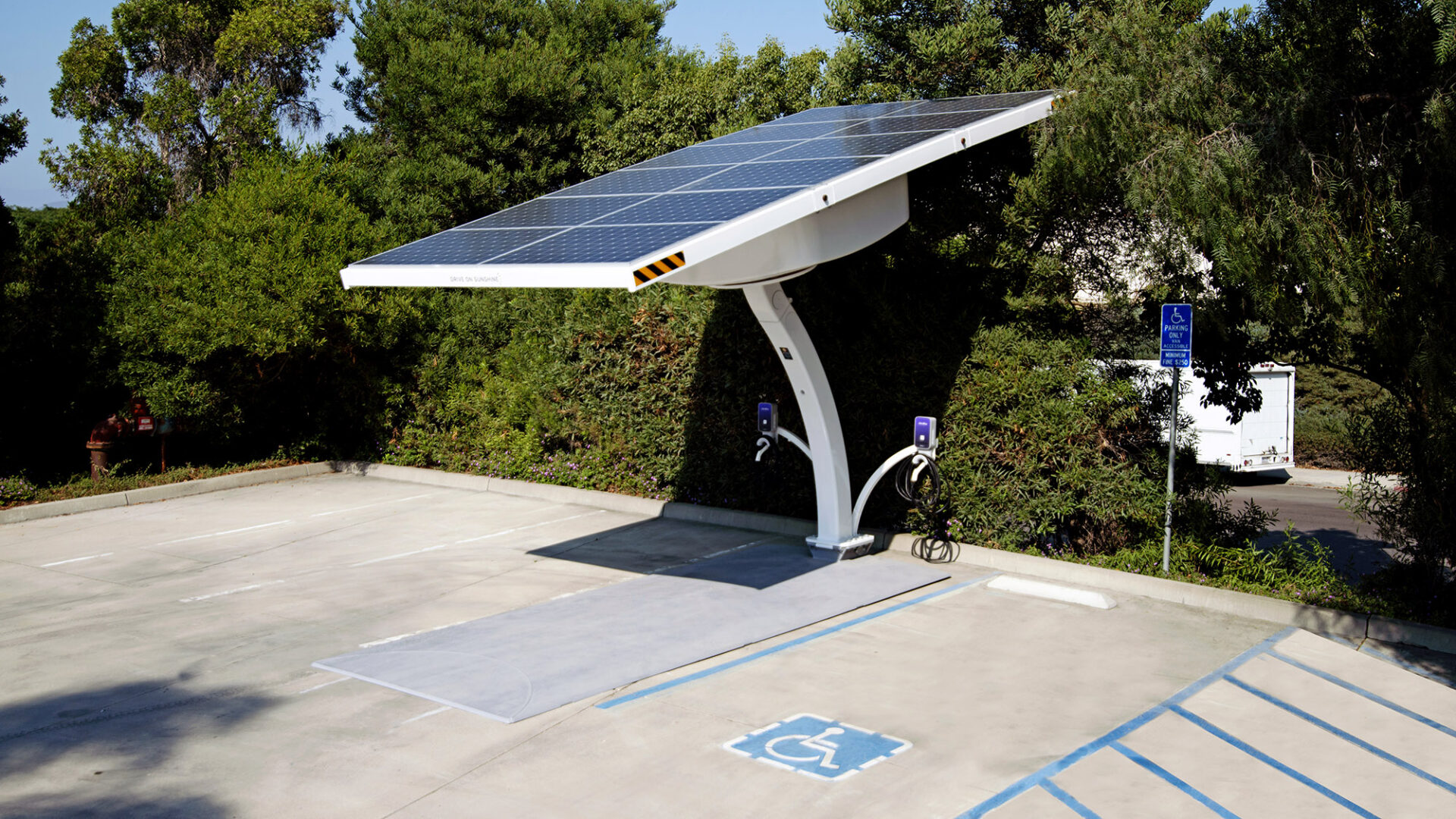 Beam EV ARC place adjacent to an ADA parking space to provide ADA compliant EV charging